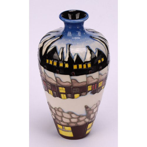 3112 - A Moorcroft baluster vase decorated with Santa in terraced street in the potteries, impressed and mo... 