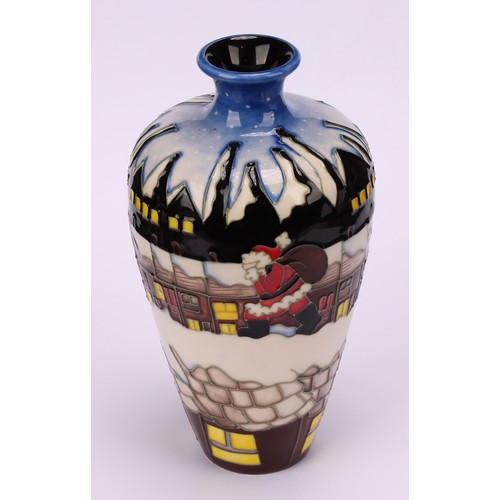 3112 - A Moorcroft baluster vase decorated with Santa in terraced street in the potteries, impressed and mo... 