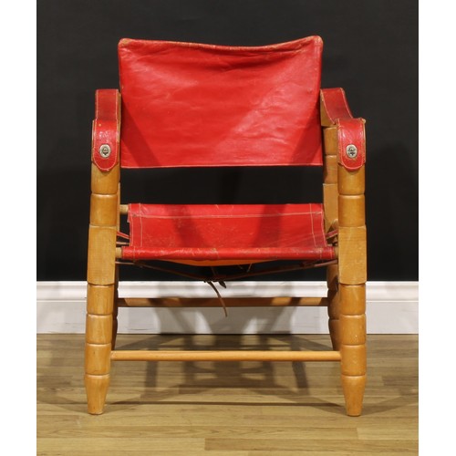 3344 - A mid-20th century safari chair, red leather coverings, 71cm high, 54cm wide

NB - This lot is offer... 