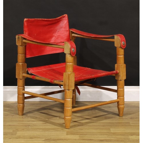 3344 - A mid-20th century safari chair, red leather coverings, 71cm high, 54cm wide

NB - This lot is offer... 