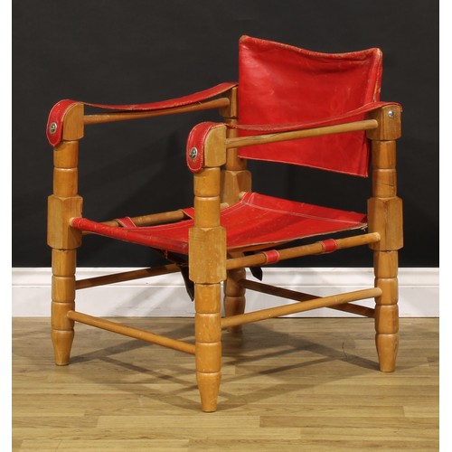 3344 - A mid-20th century safari chair, red leather coverings, 71cm high, 54cm wide

NB - This lot is offer... 