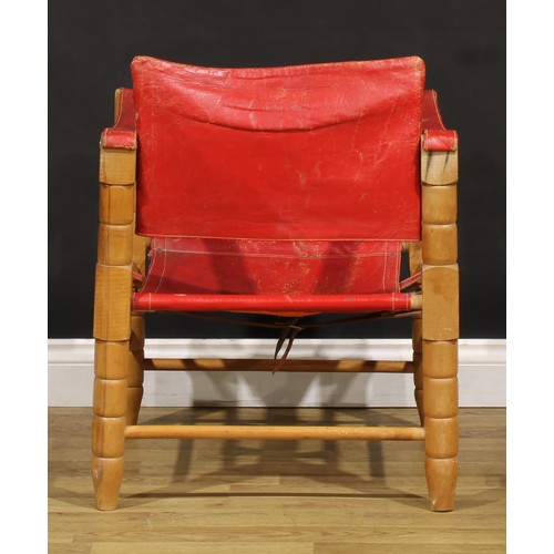 3344 - A mid-20th century safari chair, red leather coverings, 71cm high, 54cm wide

NB - This lot is offer... 