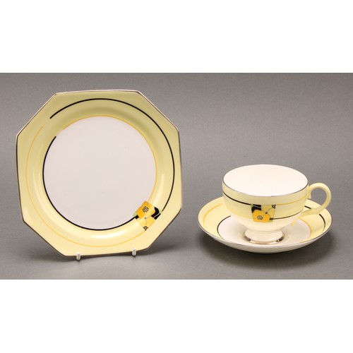 3037 - A Paragon Art Deco tea service, decorated with panels of stylised flowers, on a yellow ground, a rep... 