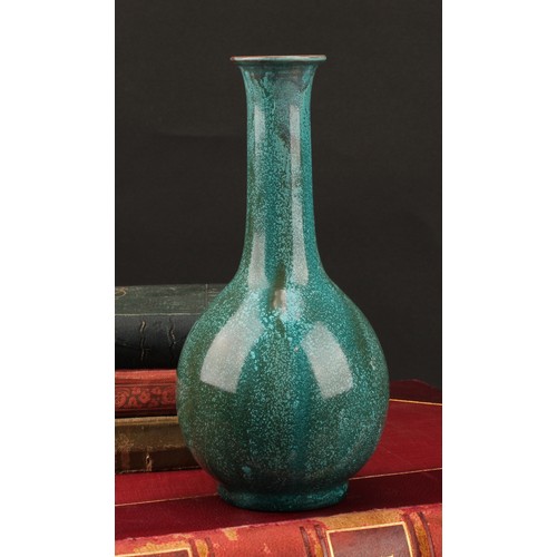 3039 - A Pilkington's Royal Lancastrian bottle vase, drip glazed in mottled turquoise green shades, flared ... 