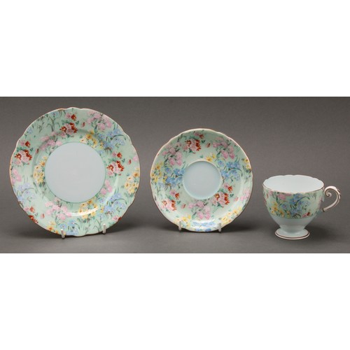 3155 - A Shelley Melody pattern part dinner and tea set, printed with chintz blossom, printed marks; qty