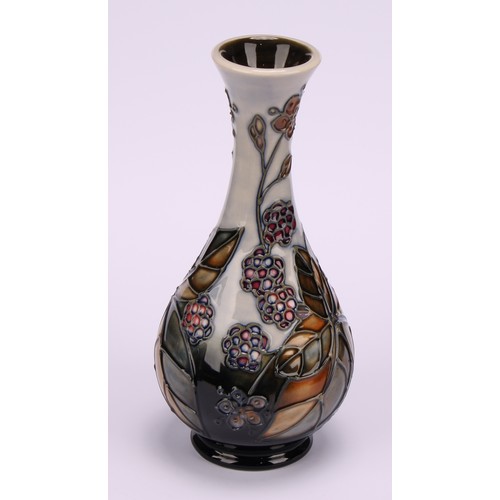 3114 - A Moorcroft Blackberry Bramble pattern ovoid bottle vase, 16.5cm high, impressed marks; a Moorcroft ... 