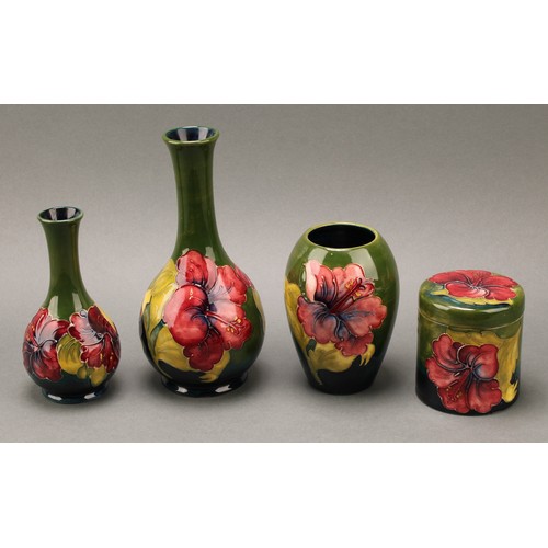 3120 - A Moorcroft Hibiscus pattern ovoid bottle vase, 21.5cm high, monogrammed, impressed mark; another, s... 