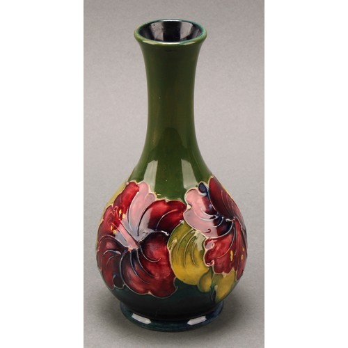 3120 - A Moorcroft Hibiscus pattern ovoid bottle vase, 21.5cm high, monogrammed, impressed mark; another, s... 