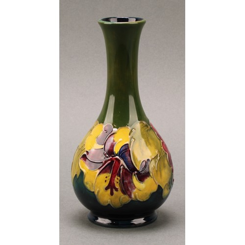 3120 - A Moorcroft Hibiscus pattern ovoid bottle vase, 21.5cm high, monogrammed, impressed mark; another, s... 