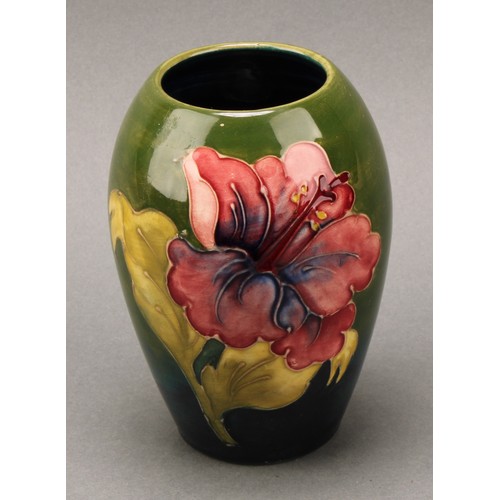 3120 - A Moorcroft Hibiscus pattern ovoid bottle vase, 21.5cm high, monogrammed, impressed mark; another, s... 