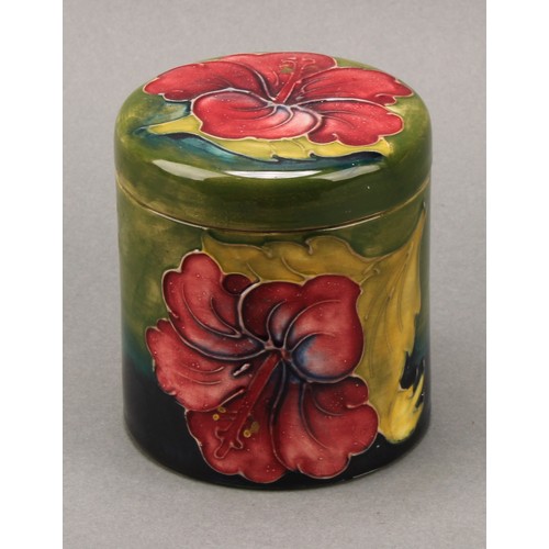 3120 - A Moorcroft Hibiscus pattern ovoid bottle vase, 21.5cm high, monogrammed, impressed mark; another, s... 