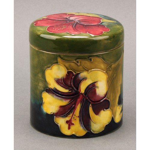 3120 - A Moorcroft Hibiscus pattern ovoid bottle vase, 21.5cm high, monogrammed, impressed mark; another, s... 