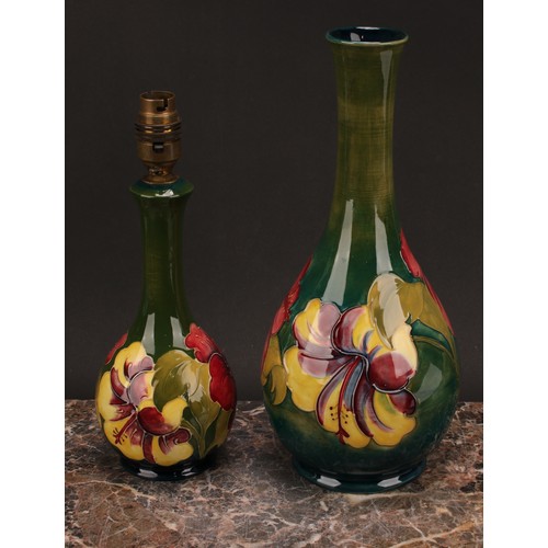 3121 - A Moorcroft Hibiscus pattern ovoid bottle vase, 32cm high, monogrammed, impressed mark, late Queen M... 