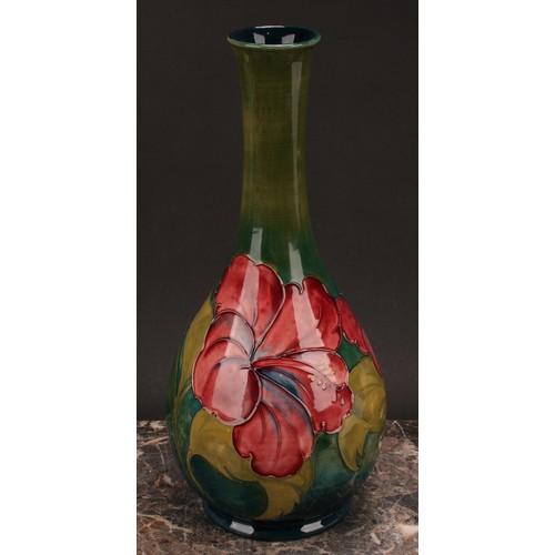 3121 - A Moorcroft Hibiscus pattern ovoid bottle vase, 32cm high, monogrammed, impressed mark, late Queen M... 