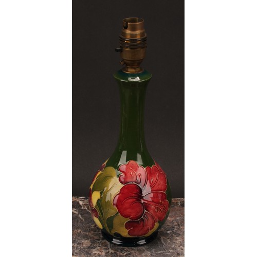 3121 - A Moorcroft Hibiscus pattern ovoid bottle vase, 32cm high, monogrammed, impressed mark, late Queen M... 