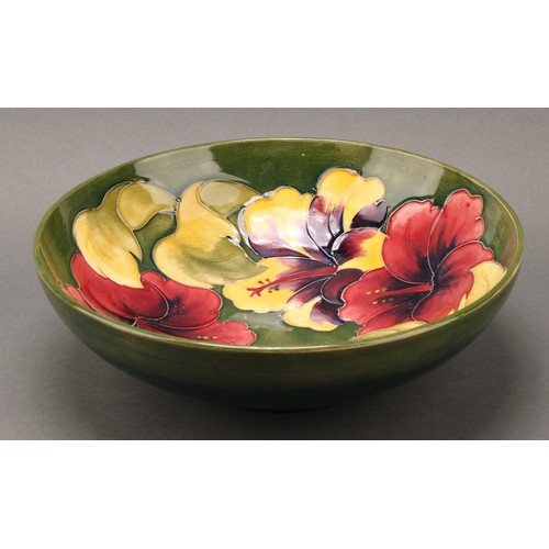 3118 - A Moorcroft Hibiscus pattern bowl, 26cm diameter, monogrammed, impressed mark; another, smaller, 18.... 