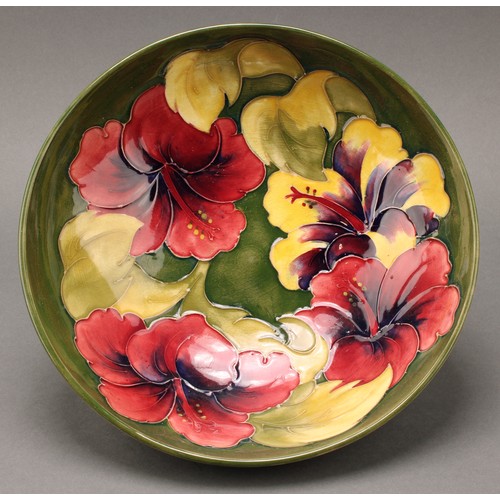 3118 - A Moorcroft Hibiscus pattern bowl, 26cm diameter, monogrammed, impressed mark; another, smaller, 18.... 