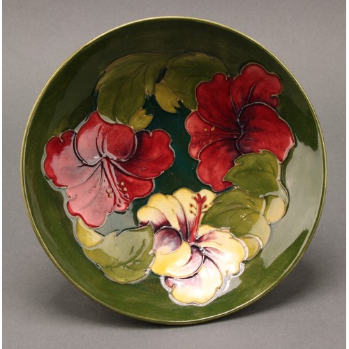 3118 - A Moorcroft Hibiscus pattern bowl, 26cm diameter, monogrammed, impressed mark; another, smaller, 18.... 