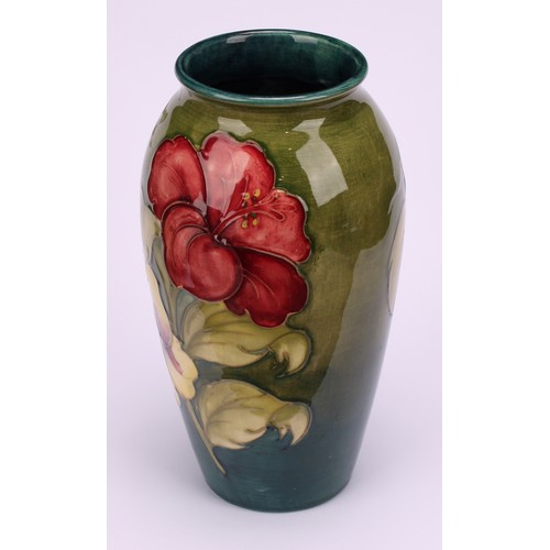 3122 - A Moorcroft Hibiscus pattern ovoid vase, 18.5cm high, monogrammed, impressed mark, late Queen Mary p... 