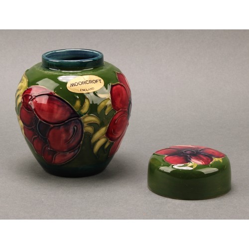 3111 - A Moorcroft Anemone pattern ginger jar and cover, 10.5cm high, impressed mark, boxed; an associated ... 