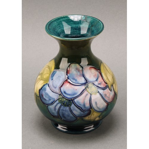 3111 - A Moorcroft Anemone pattern ginger jar and cover, 10.5cm high, impressed mark, boxed; an associated ... 