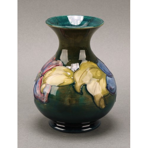 3111 - A Moorcroft Anemone pattern ginger jar and cover, 10.5cm high, impressed mark, boxed; an associated ... 