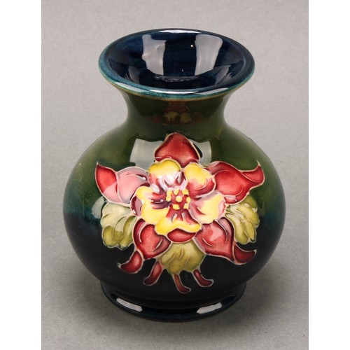 3111 - A Moorcroft Anemone pattern ginger jar and cover, 10.5cm high, impressed mark, boxed; an associated ... 