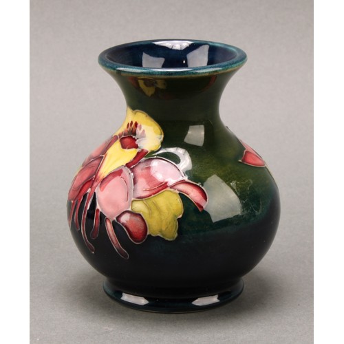 3111 - A Moorcroft Anemone pattern ginger jar and cover, 10.5cm high, impressed mark, boxed; an associated ... 