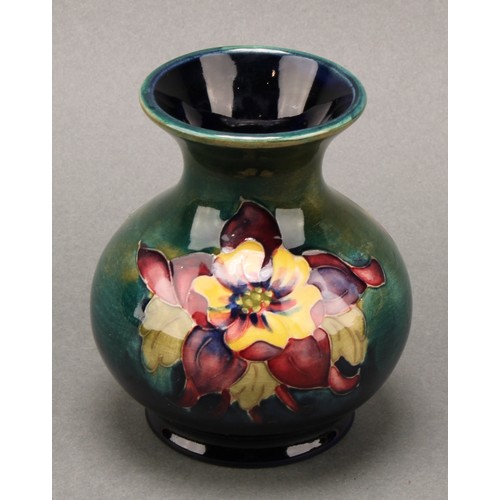 3111 - A Moorcroft Anemone pattern ginger jar and cover, 10.5cm high, impressed mark, boxed; an associated ... 