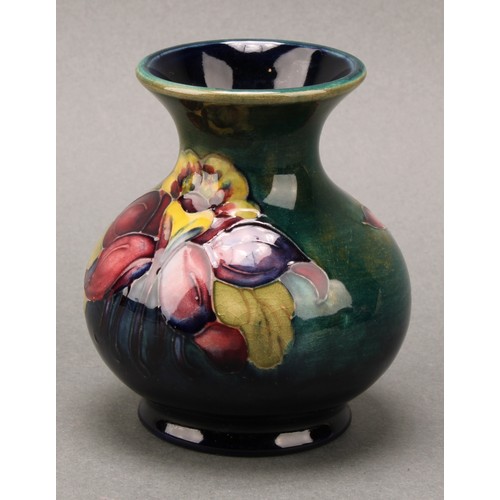 3111 - A Moorcroft Anemone pattern ginger jar and cover, 10.5cm high, impressed mark, boxed; an associated ... 