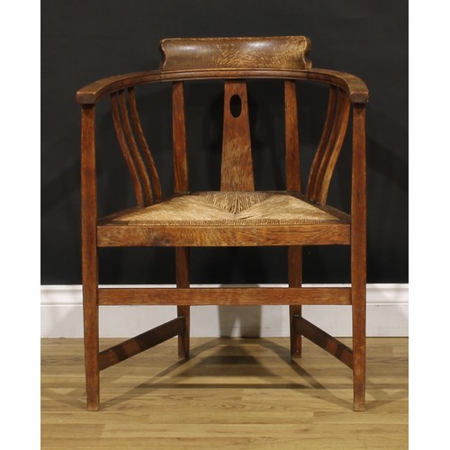 3411 - An Arts & Crafts oak elbow chair, possibly Glasgow School, in the manner of E.A. Taylor and Wylie & ... 