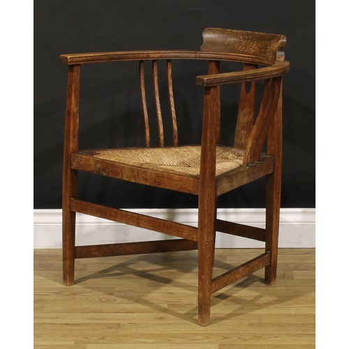 3411 - An Arts & Crafts oak elbow chair, possibly Glasgow School, in the manner of E.A. Taylor and Wylie & ... 