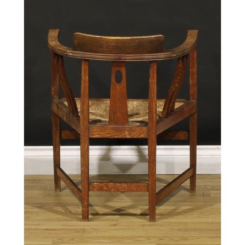 3411 - An Arts & Crafts oak elbow chair, possibly Glasgow School, in the manner of E.A. Taylor and Wylie & ... 