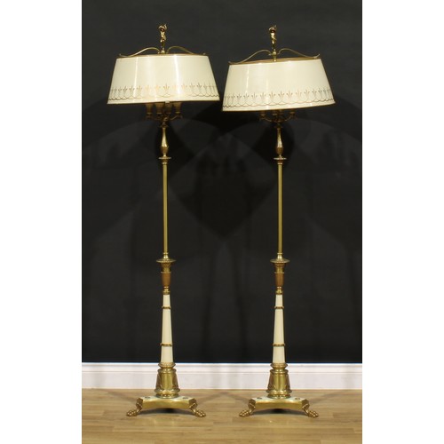 3425 - Interior Design - a pair of Neoclassical design brass and tole floor lamps, the base weight impresse... 