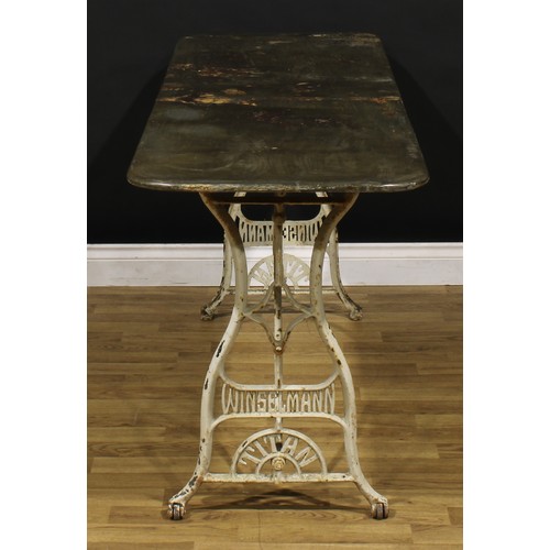 3416 - Industrial Salvage - an early 20th century cast iron and sheet metal work table, rounded rectangular... 