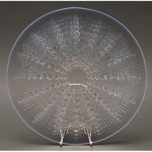 3240 - A Lalique Oursins opalescent glass circular plate, reverse moulded with a burst of radiating stylise... 