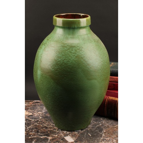 3029 - A large C H Brannam, Barum, Barnstaple terracotta ovoid vase, drip glazed in mottled moss green, 39c... 