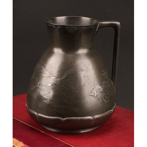 3313 - A German Jugenstil Kayserzinn pewter jug, moulded with a shoal of fish, lily pad borders, angular ha... 