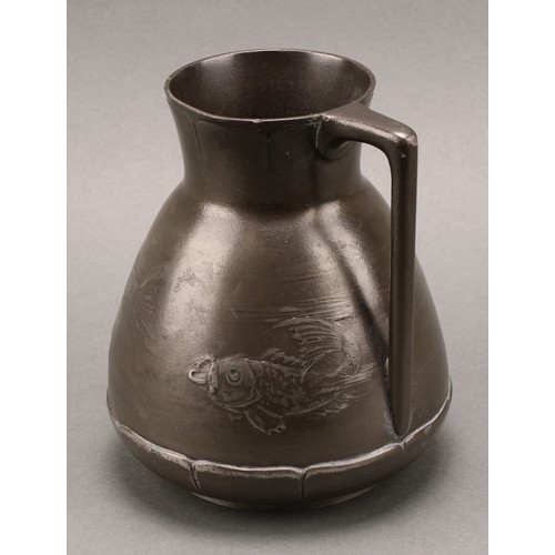 3313 - A German Jugenstil Kayserzinn pewter jug, moulded with a shoal of fish, lily pad borders, angular ha... 