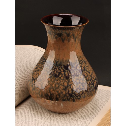 3027 - A Lancastrian Pottery baluster vase, drip glazed in mottled lustrous shades of brown and ochre, 21cm... 