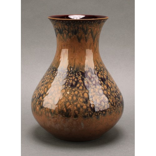 3027 - A Lancastrian Pottery baluster vase, drip glazed in mottled lustrous shades of brown and ochre, 21cm... 