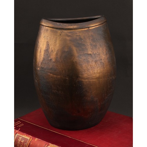 3211 - Studio Pottery - Chris Carter (Bn.1945), a compressed ovoid vase, volcano glazed in lustrous bronze ... 