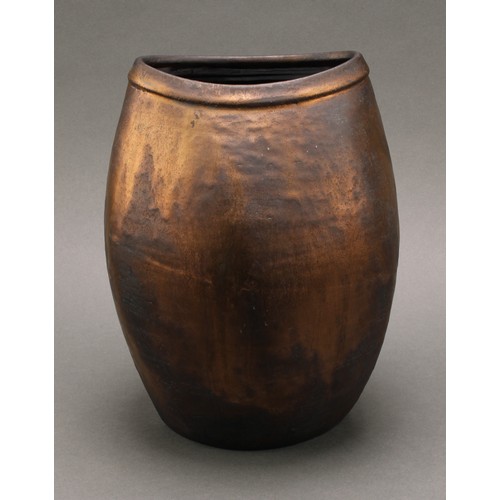 3211 - Studio Pottery - Chris Carter (Bn.1945), a compressed ovoid vase, volcano glazed in lustrous bronze ... 