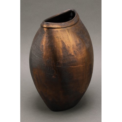 3211 - Studio Pottery - Chris Carter (Bn.1945), a compressed ovoid vase, volcano glazed in lustrous bronze ... 