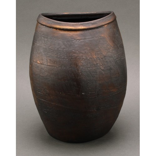 3211 - Studio Pottery - Chris Carter (Bn.1945), a compressed ovoid vase, volcano glazed in lustrous bronze ... 