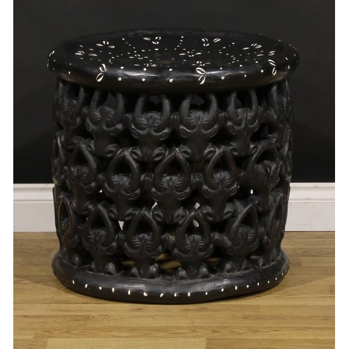 3360 - Tribal Art & the Eclectic Interior - a Bamileke stool, dished circular top, the side pierced and car... 