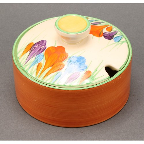 3010 - A pair of Clarice Cliff Crocus pattern compressed circular preserve jars and covers, 7cm high, Newpo... 