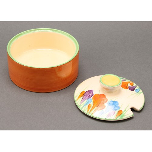 3010 - A pair of Clarice Cliff Crocus pattern compressed circular preserve jars and covers, 7cm high, Newpo... 