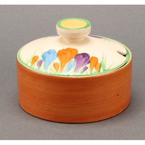 3010 - A pair of Clarice Cliff Crocus pattern compressed circular preserve jars and covers, 7cm high, Newpo... 