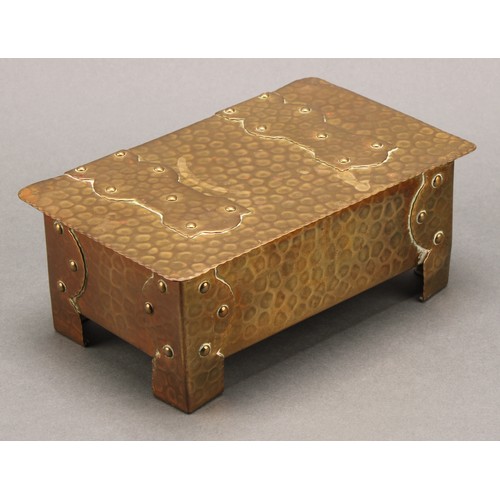 3365 - An Arts and Crafts brass rectangular cigar box, riveted strap hinges and bracket feet, planished ove... 